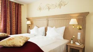 Postel nebo postele na pokoji v ubytování Hotel Rebstock