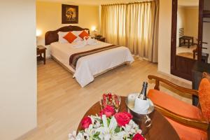 Voodi või voodid majutusasutuse Hotel Agustos Cusco toas