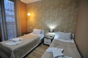 Postel nebo postele na pokoji v ubytování Renaissance Hotel Tbilisi