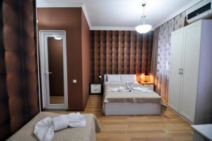 Postel nebo postele na pokoji v ubytování Renaissance Hotel Tbilisi