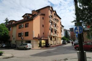 a building on the side of a street at Hotel Kibella in Sofia