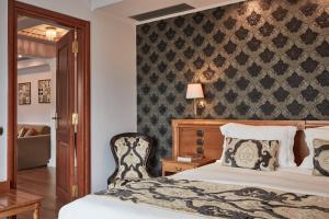 Voodi või voodid majutusasutuse Ava Hotel and Suites toas