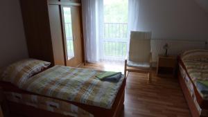 Ένα ή περισσότερα κρεβάτια σε δωμάτιο στο Penzion Slávka