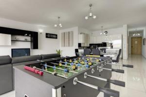 a living room with a table with legos on it at Water's Edge Apartment in St. Paul's Bay