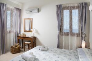 Posteľ alebo postele v izbe v ubytovaní Natica Mare Villas