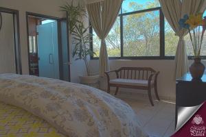 A bed or beds in a room at Casa Corazon de Plata Suites