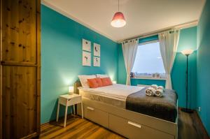 Tempat tidur dalam kamar di Apartament Szafranowy
