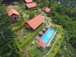 an aerial view of a house with a swimming pool at Villa Domanik in Labuan Bajo