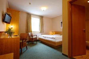 
Ein Bett oder Betten in einem Zimmer der Unterkunft Hotel Eberl
