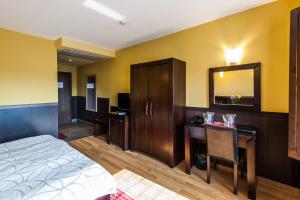 A bed or beds in a room at Hotel Ego - Free Parking - Top Central Location