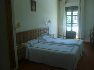 A bed or beds in a room at Hotel Hispanidad