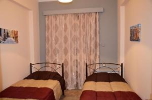 Posteľ alebo postele v izbe v ubytovaní Kalimera Apartment