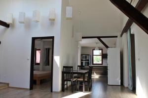 a kitchen and dining room with a table and chairs at Attic with parking, near the center of ČB - 110m2 in České Budějovice