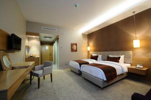 Ramada by Wyndham Podgorica客房内的一张或多张床位