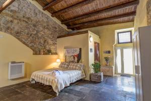 Postel nebo postele na pokoji v ubytování B&B Vico Manenti