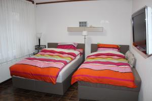 Säng eller sängar i ett rum på Fewo An der Mühlenbachaue