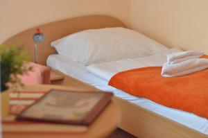 Postel nebo postele na pokoji v ubytování Hotel Paradies