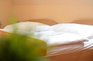 Postel nebo postele na pokoji v ubytování Hotel Paradies