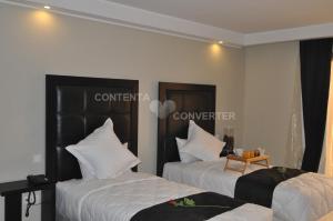 Postel nebo postele na pokoji v ubytování Tempoo Hotel Marrakech City Centre Adults Only