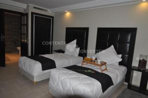 Postel nebo postele na pokoji v ubytování Tempoo Hotel Marrakech City Centre Adults Only