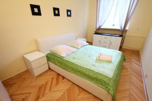 Cama o camas de una habitación en Capital Apartments - Old Town