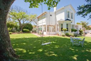 a swing in the yard of a house at Brooklands House in Cape Town