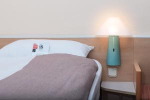 Postel nebo postele na pokoji v ubytování ibis Koblenz City