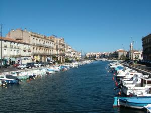 a group of boats are docked in a river at Sete in Sète +7 photos