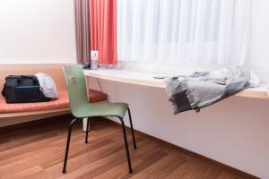 Postel nebo postele na pokoji v ubytování ibis Koblenz City
