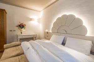 Voodi või voodid majutusasutuse Hotel Paradiso toas