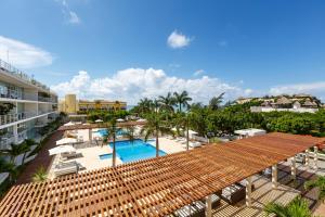 an aerial view of the pool at the resort at Magia Beachside Condo in Playa del Carmen
