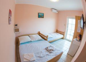 Кровать или кровати в номере Guest House Almond