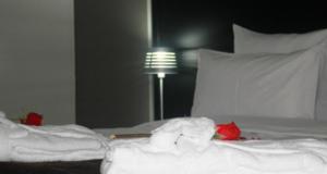 Ένα ή περισσότερα κρεβάτια σε δωμάτιο στο Ubay Hotel