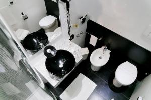 Kúpeľňa v ubytovaní Ilga Hotel