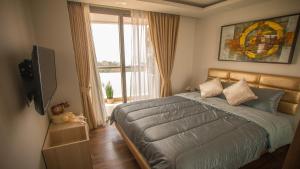 Postel nebo postele na pokoji v ubytování Luxury Seaview Condo The Peak Towers 200m To Beach + 75 fotografií