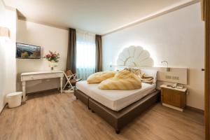 Voodi või voodid majutusasutuse Hotel Paradiso toas