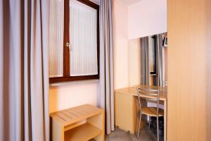 Posteľ alebo postele v izbe v ubytovaní Albergo Verdi