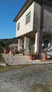 a large house with plants in front of it at Casa di Giulia (Bambini gratis fino a 6 anni) in Santa Luce