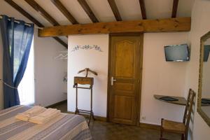 Ein Bett oder Betten in einem Zimmer der Unterkunft Chambres d'Hôtes Garicoitz