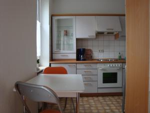 Virtuvė arba virtuvėlė apgyvendinimo įstaigoje Pension Domicil