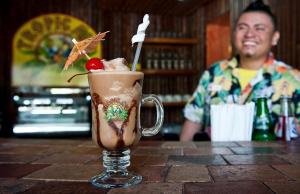 a drink in a glass mug on a table at Ramon's Village Resort in San Pedro