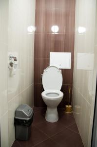 a bathroom with a toilet and a trash can at Apartment Medical University in Pleven