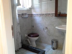 a bathroom with a toilet and a sink at Beachfront home for 8, Kalifteri Beach, Afissos in Afissos +10 photos