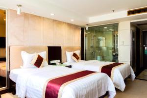 Letto o letti in una camera di New World Hotel