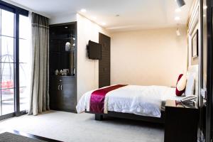 Letto o letti in una camera di New World Hotel
