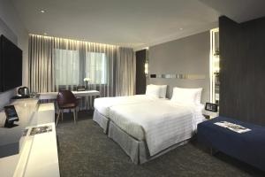Uma cama ou camas num quarto em Nathan Hotel