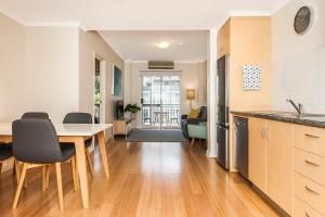 A kitchen or kitchenette at Colin Street Apartment