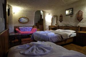 Postel nebo postele na pokoji v ubytování Anatolia cave hotel Pension