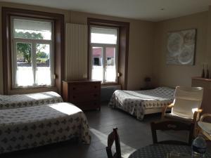 Un pat sau paturi într-o cameră la La Cense Hebron