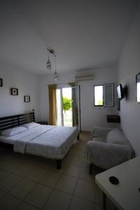 Letto o letti in una camera di Elea Apartments